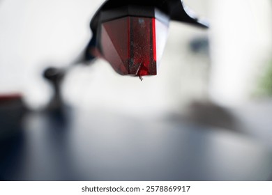 Close-up of a turntable stylus needle in sharp focus