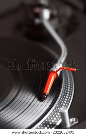 Closeup, turntable and vinyl for music system, professional dj job and needle for sound, party and vintage audio gear. Zoom, retro record player and disc for scratch, spinning and club for listening