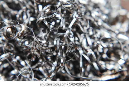 Closeup Twisted Spiral Steel Shavings. Cast Iron Scrap