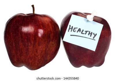 Close-up of two apples with an adhesive note