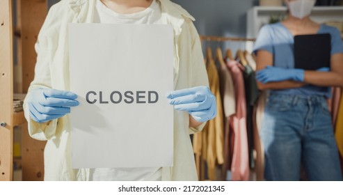 Close-up Two Asian Lady With Casual Wear Protection Glove Surgical Mask Hold Tablet Keep Social Distance Show Close Sign In Shop Get Business Trouble On Virus Pandemic No Order From Customer.