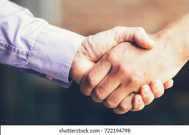 Closeup Of Two Business Men Shaking Hands