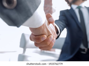 Close-up Of Two Business People Shaking Hands