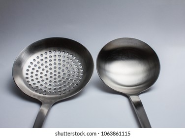 close-up of two cooking spoons on a white background - Powered by Shutterstock