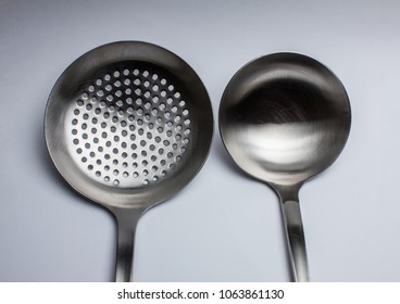 close-up of two cooking spoons on a white background - Powered by Shutterstock