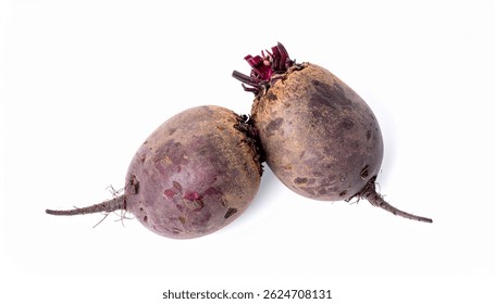Closeup of two earthytoned beetroots, showcasing their roots and slightly textured skin. They are positioned on a plain white background.