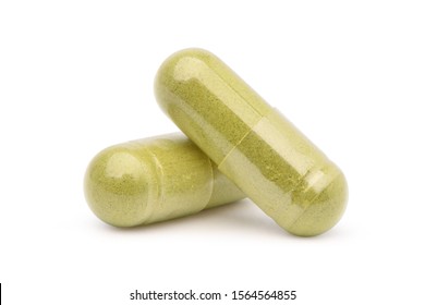Close-up Two Herb powder capsules isolated on white background. Clipping path. - Shutterstock ID 1564564855