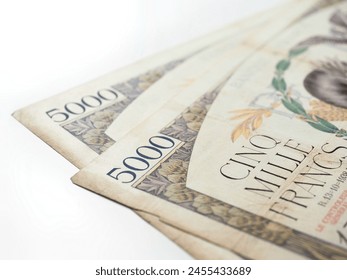 Close-up of two old five thousand 5000 french francs banknotes isolated on a white background