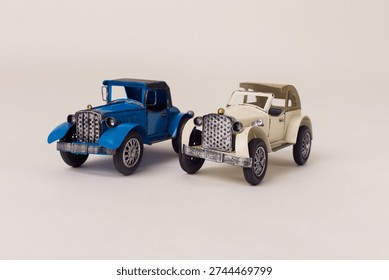 Closeup of two old-fashioned car models