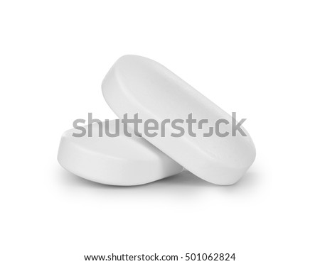 close-up of two pills isolated on white background