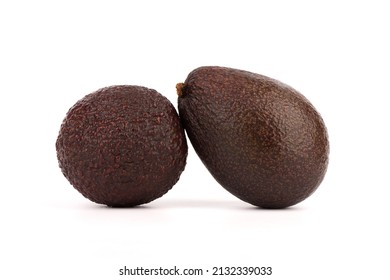 Close-up of two ripe avocados on a white background.