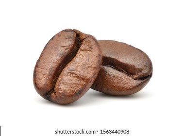 Close-up Two roasted coffee beans isolated on white background. Clipping path - Shutterstock ID 1563440908