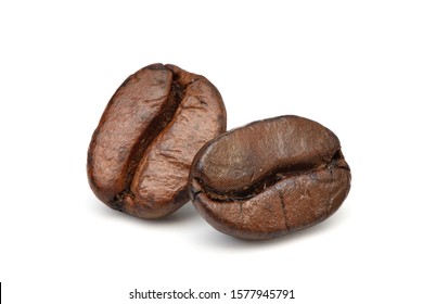 Close-up Two roasted coffee beans isolated on white background. - Shutterstock ID 1577945791