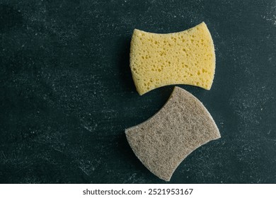 Close-up of two sponges on a black background, showcasing different textures. Ideal for illustrating household cleaning, sanitation, and eco-friendly cleaning supplies. - Powered by Shutterstock