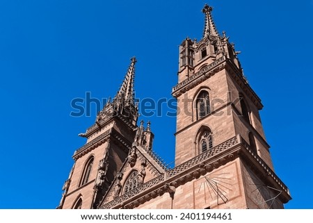 Closeup of two towers (Georgestrum on the right and Martinstrum on the left) of beautiful red sandstone church of Basel Minster Switzerland 