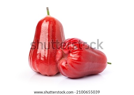 Closeup two whole fresh red rose apple isolated on white background.