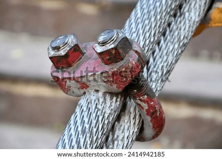 Closeup of Two Wire Rope Clamp And Steel Rope of Hanging Bridge.