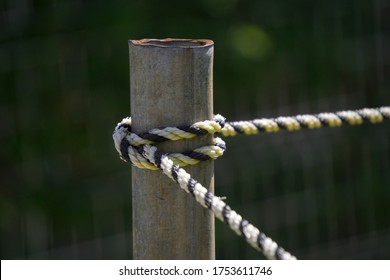 Closeup Tying The Rope To Metal Stake