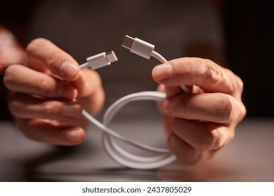 Close-up of type C wire for charging phone. Unbox type-C connector for charging phone