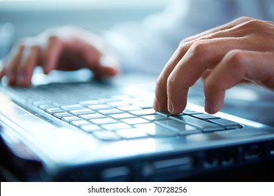Close-up of typing male hands