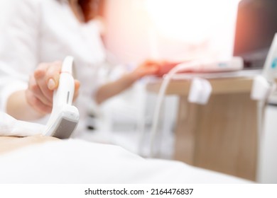 Closeup ultrasound scanner device in hand professional doctor woman use for examining patient female, sunlight. - Shutterstock ID 2164476837