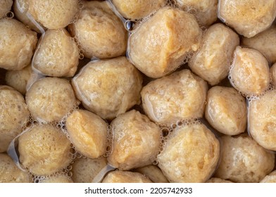 close-up of uncooked soy meat soaked in boiled water to become plump or get rid of pungent smell, cooking process of vegetarian protein rich soya bean nuggets of chunks, full frame - Shutterstock ID 2205742933