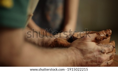 Similar – Image, Stock Photo hands working with clay in a pottery |clay transfer