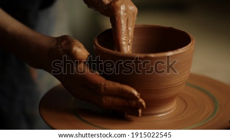 Similar – Image, Stock Photo hands working with clay in a pottery |clay transfer