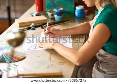 Similar – Image, Stock Photo Unrecognizable young woman crafting with paper and scissors