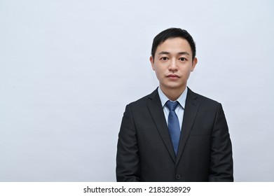 Close-up Of Upper Body Of Asian Male Office Worker, Serious Face, White Background