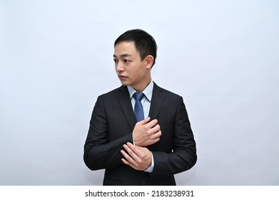 Close-up Of Upper Body Of Asian Male Office Worker, Serious Face, White Background