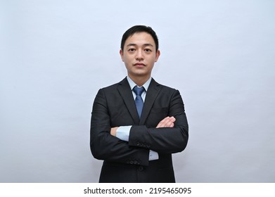 Close-up Of Upper Body Of Asian Male Office Worker, Serious Face, White Background