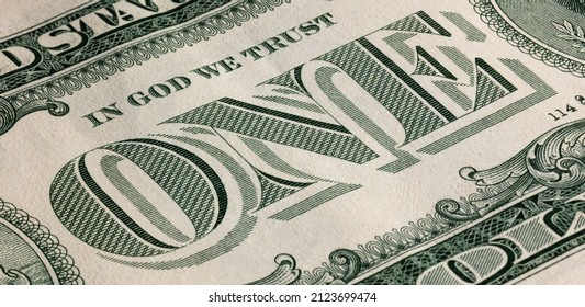 Close-up Of The US Dollar Bill With The Image Of Its Denomination In Large Print Located In The Center,