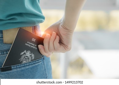 Closeup Of US Passport In The Woman's Jeans Pocket. Ready For Traveling And Vacations