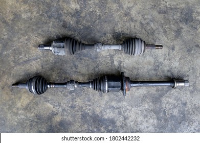 Close-up Of Used Front Wheel Drive CV Joint Drive Axle.