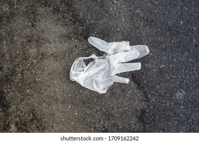 Closeup Of Used Latex Gloves Abandoned In The Street 