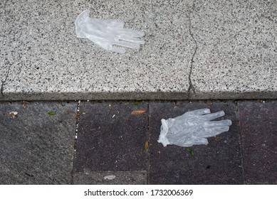 Closeup Of Used Latex Gloves Abandoned In The Street 