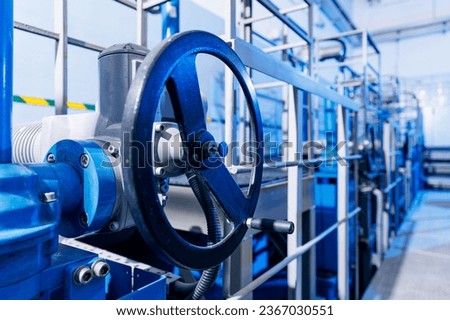 Closeup valve of blue taps for drinking water pipeline for city service. Banner industry waterworks.