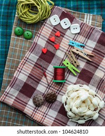 Closeup Various Sewing Supplies Lying On The Fabric.