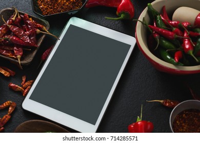 Close-up of various spices with digital tablet on black background - Powered by Shutterstock