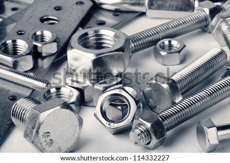 Close-up of various steel nuts and bolts