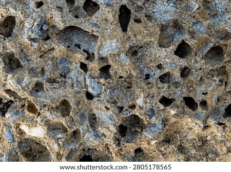 Close-up with vesicular basalt texture, a type of volcanic rock characterized by its high porosity