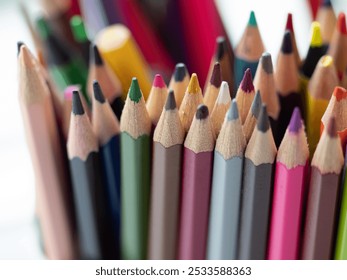 Close-Up of Vibrant Collection of Colorful Colored Pencils in a pen holder. Creative Art. Colourful assortment of sharpened colored pencils for art projects, drawing, and creativity. Artist's studio - Powered by Shutterstock