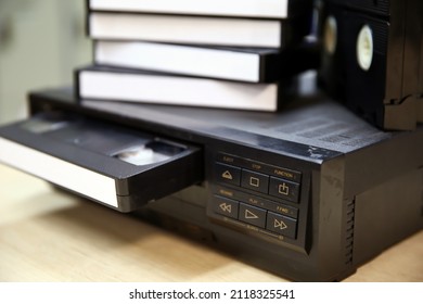 Close-up video cassette tape on video playback VHS old retro style concept of vintage electric and electronic appliances multimedia record player device old fashioned.