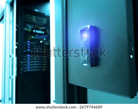 A close-up view of an access control system in a modern data center, highlighting advanced security technology and biometric authentication for server safety.