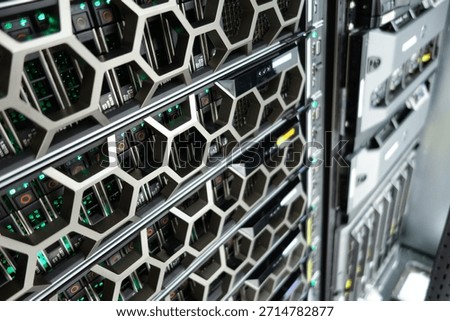 Close-up view of an advanced server rack within a data center, showcasing intricate design and modern technology enabling efficient computing and storage solutions.