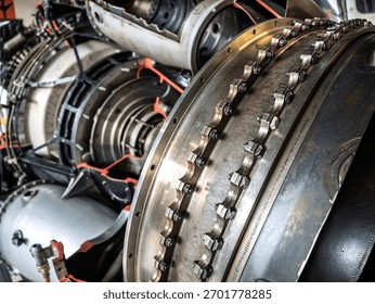 Close-up view of an aircraft engine section showing metal bolts, rings, and turbine components, highlighting the engineering precision, mechanical complexity, and industrial craftsmanship.