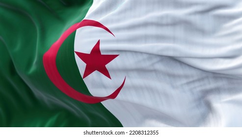 Close-up View Of The Algeria National Flag Waving In The Wind. People Democratic Republic Of Algeria, Is A Country In North Africa. Fabric Textured Background. Selective Focus