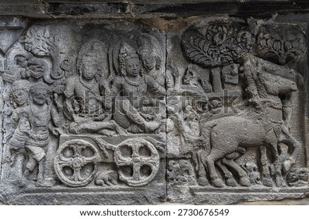 Closeup view of ancient stone bas-relief of Rama, Sita and Lakhsmana leaving for exile, Shiva temple, Prambanan, Yogyakarta, Central Java, Indonesia
