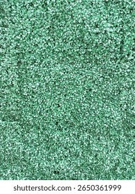 Close-up view of artificial grass surface with dense texture and even pattern, perfect for outdoor decoration.